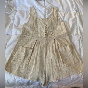 Cream Flowy Romper with mother of pearl buttons